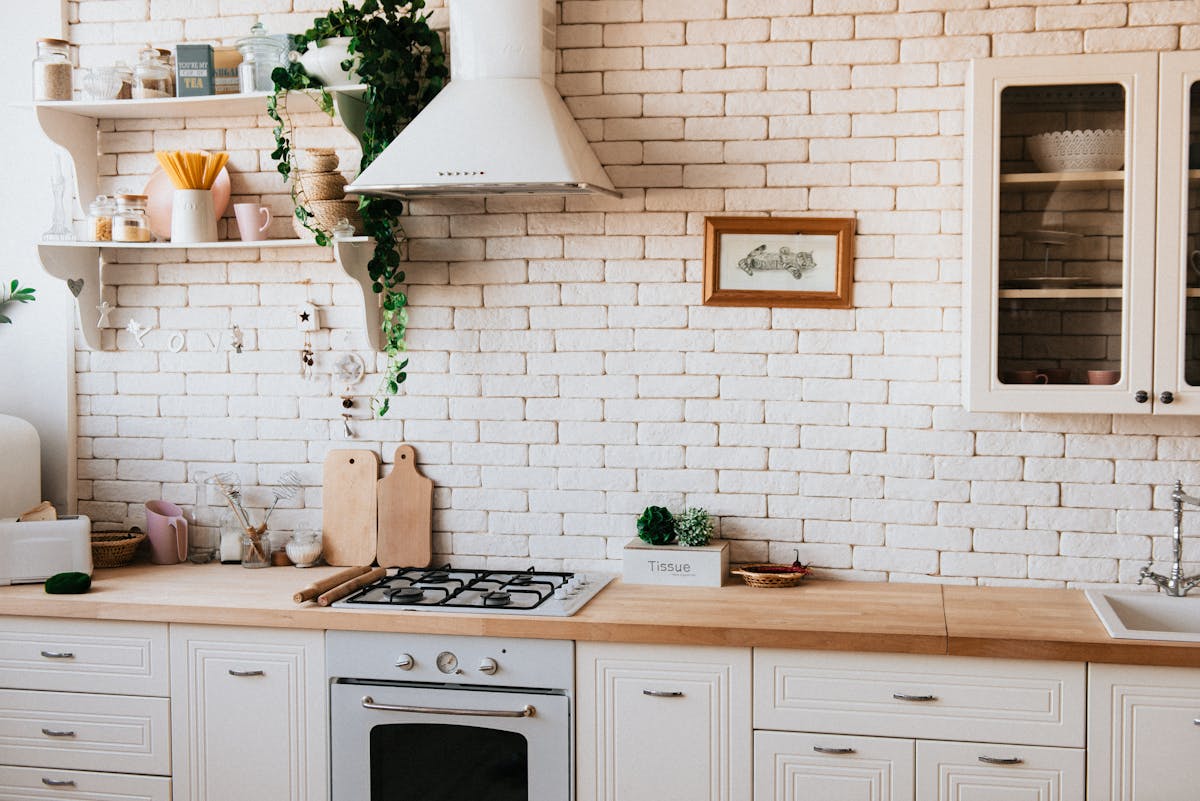 mom in organized kitchen preparing food with countertop appliances
