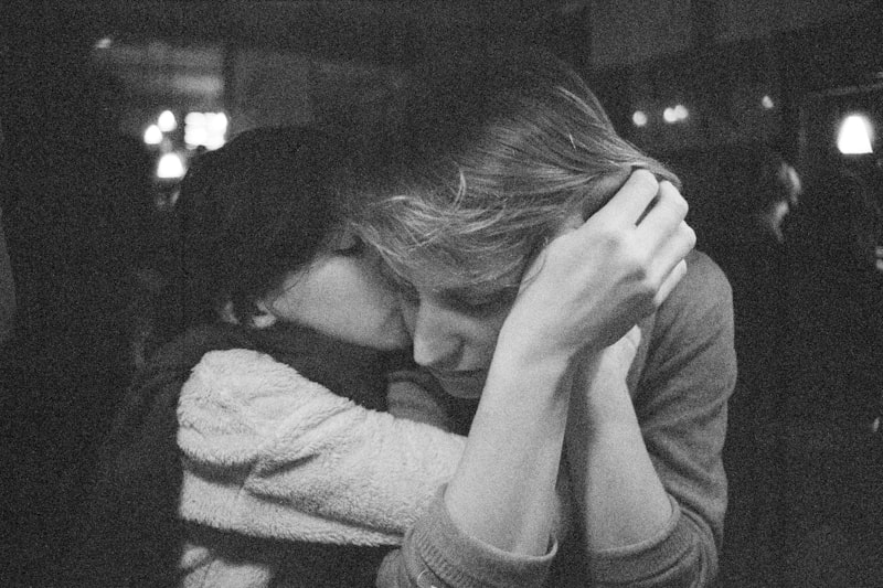 Mom sitting beside child offering emotional support